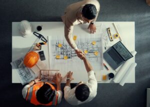 Top,Down,Aerial,View,Of,Architect,Engineer,Team,Shake,Hands Top,Down,Aerial,View,Of,Architect,Engineer,Team,Shake,Hands